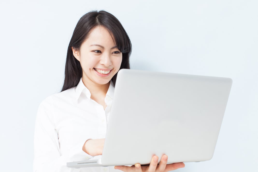 Japanese woman holding PC